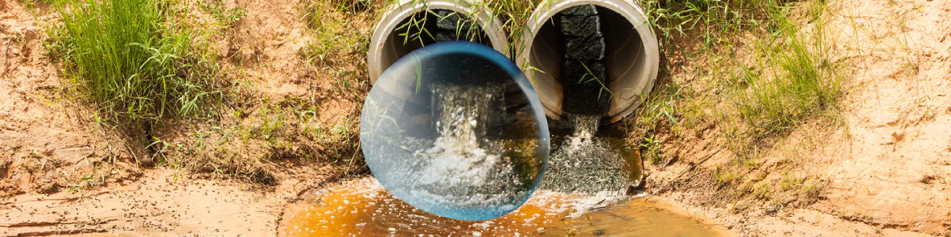 Pipes spilling sewage into river
