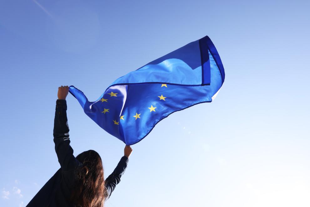 Woman holding European Union flag
