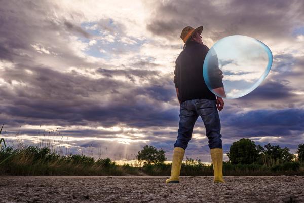 farmer looking at the sky