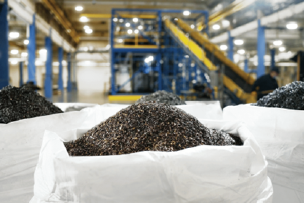 Battery waste known as 'black mass' fills up three bags in a battery recycling centre